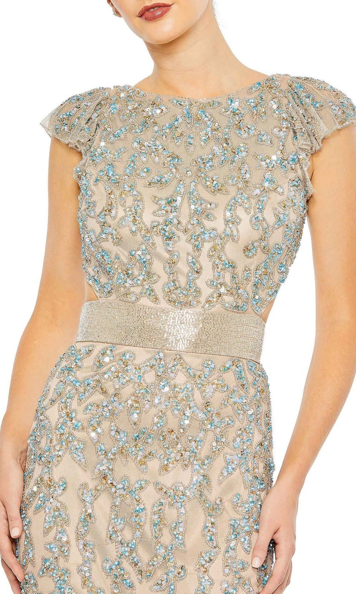 Woman wearing the Mac Duggal 5689 Long Nude Beaded Formal Dress, featuring cap sleeves, blue and gold embroidery, and a wide shimmery belt. Only the upper body is shown.